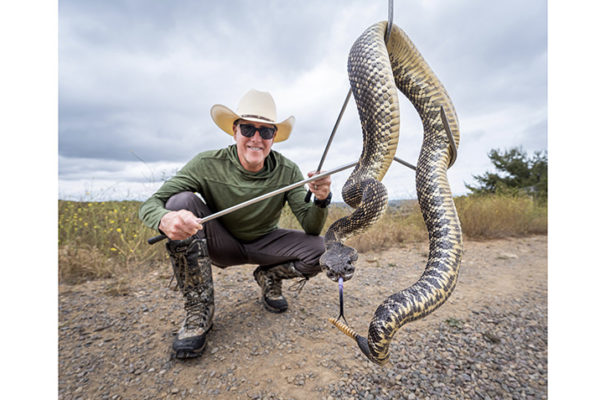 Wrangler Bruce with large Southern Pacific Rattlesnake